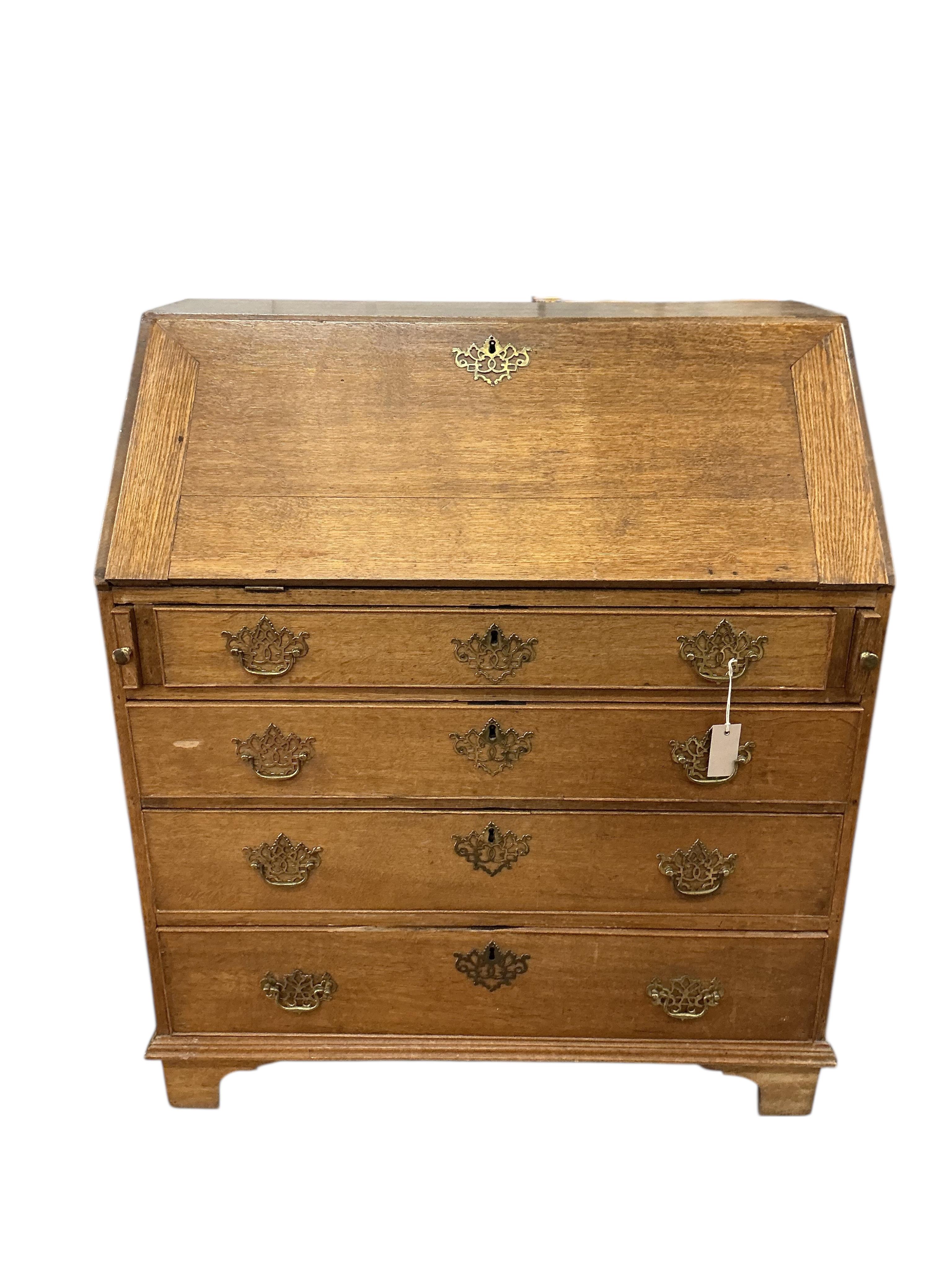 A George III oak bureau, width 91cm, depth 52cm, height 105cm